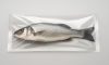Branzino fresco intero confezionato sottovuoto in busta trasparente